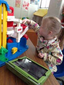 Playing with the cars in the toy room....